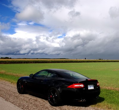 Thunderclouds on the horizon, or is it the rumbling exhaust note of the Black Back we hear in the distance? City or country, the 2011 Jaguar XKR looks dashing. Of course, it's the open road of the countryside that appeals most to this 510-hp luxury sports coupe. Photo: Bill Roebuck